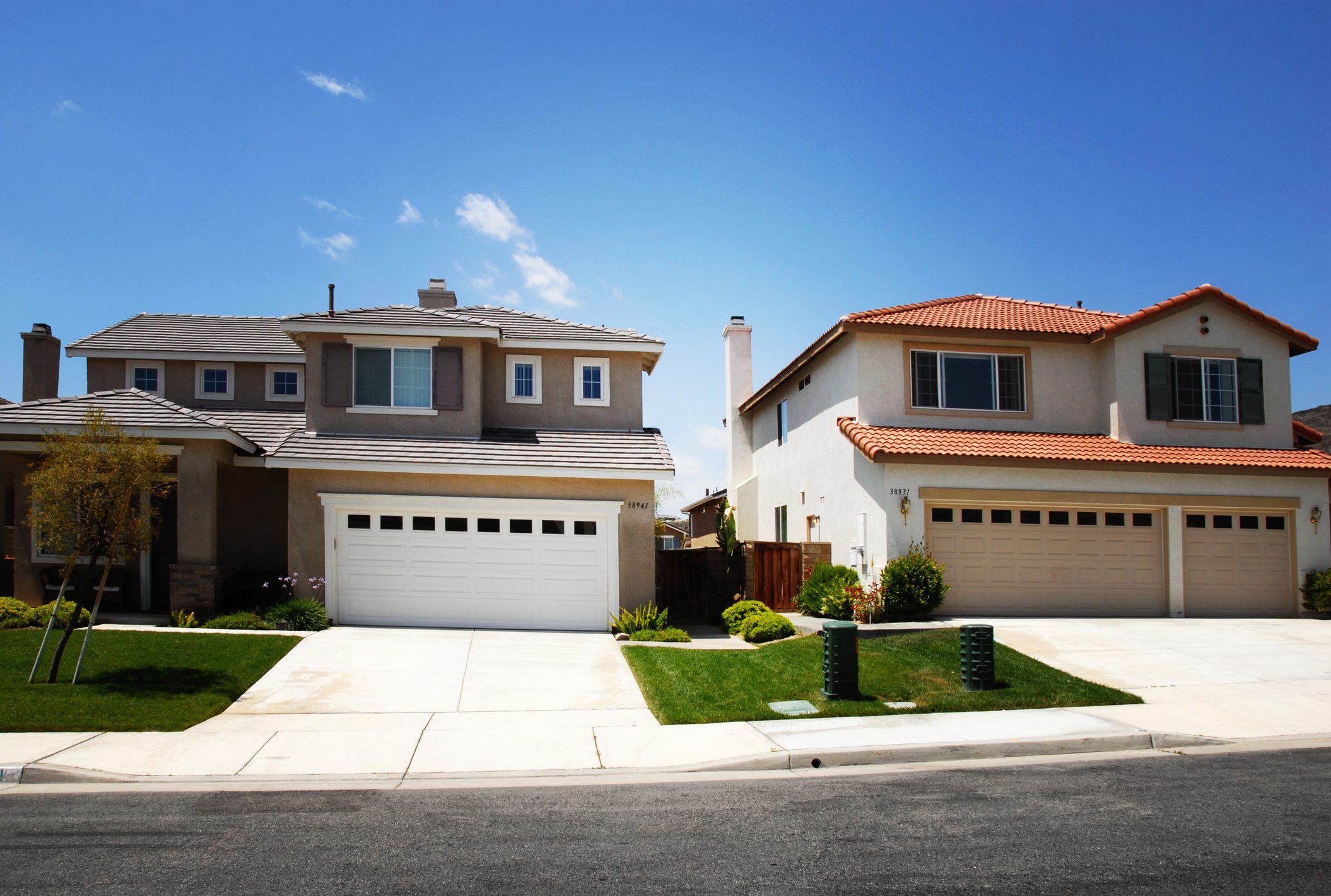 Suburban homes with blue sky background.